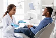 /content/dam/uhc/uhone/health-and-wellness/wide-ManTalkingToDentist-1253026118.jpg